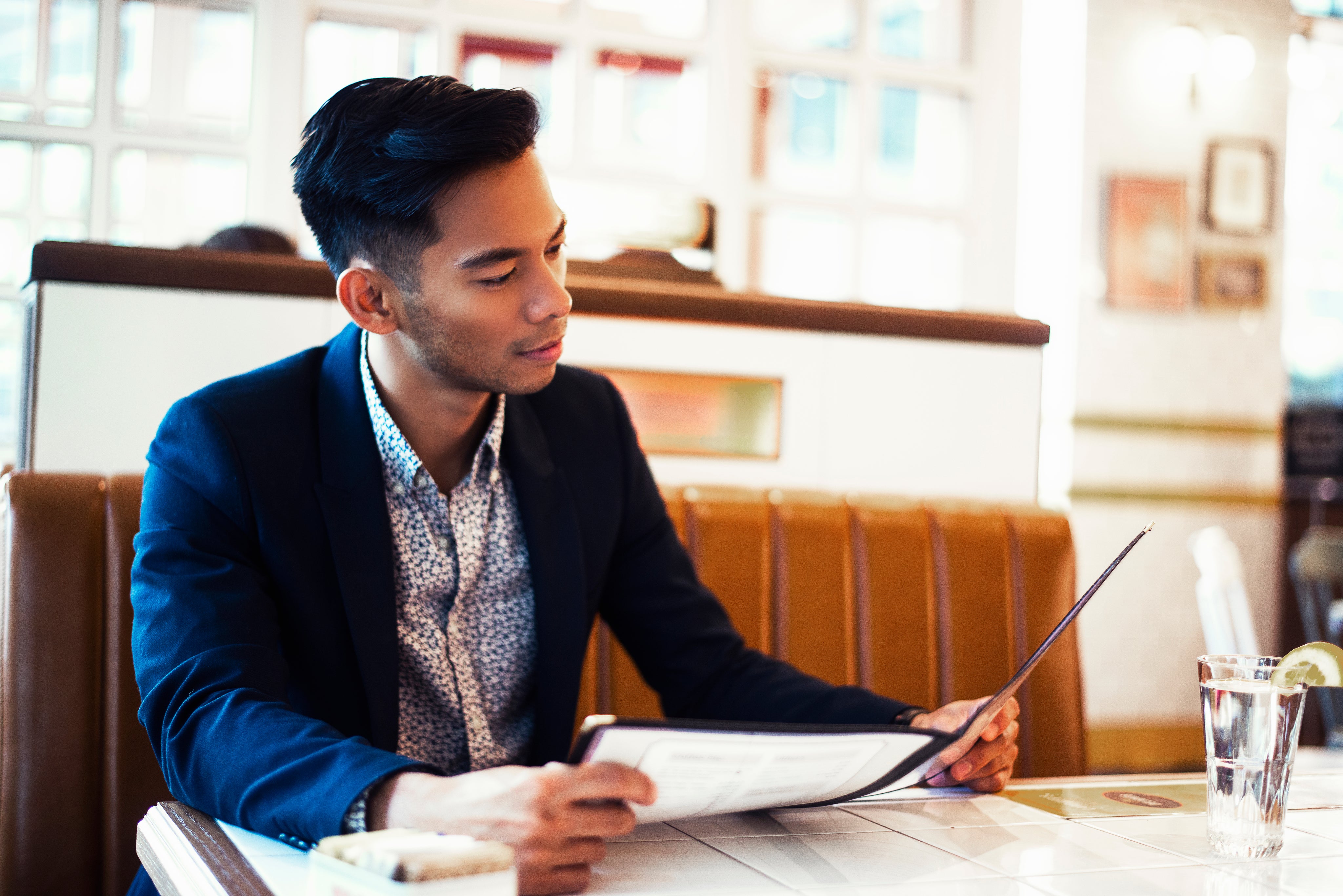 files/man-looks-at-menu-in-restaurant.jpg